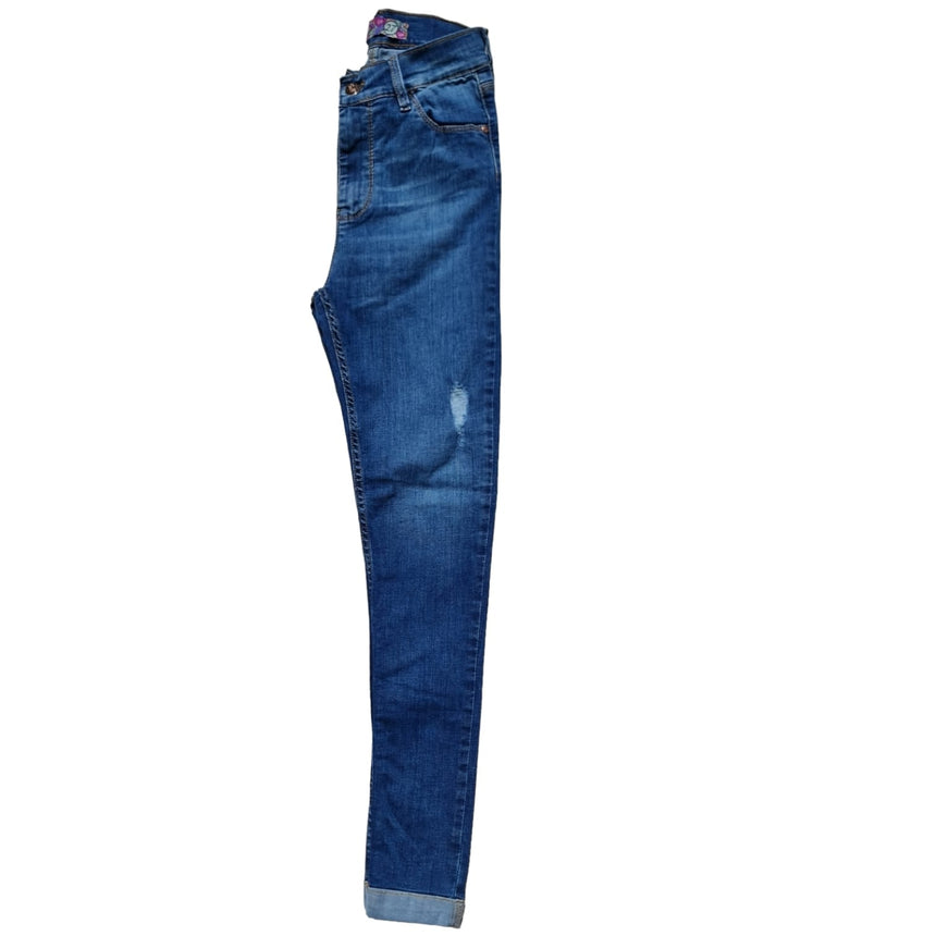 Skinny tiro alto con dobladillo y roturas