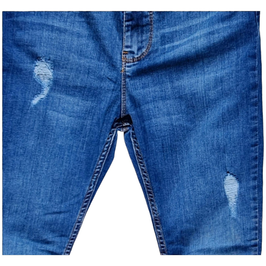 Skinny tiro alto con dobladillo y roturas