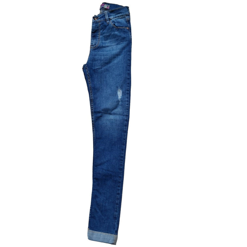 Skinny tiro alto con dobladillo y roturas