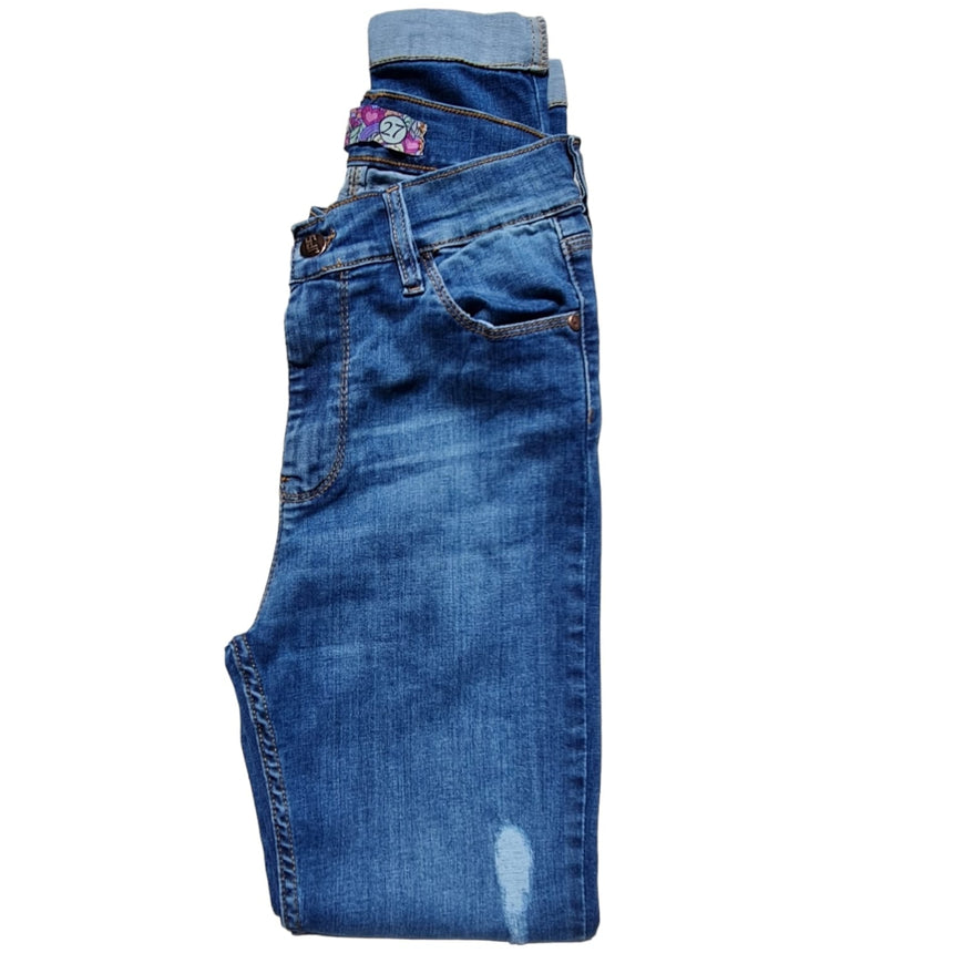 Skinny tiro alto con dobladillo y roturas