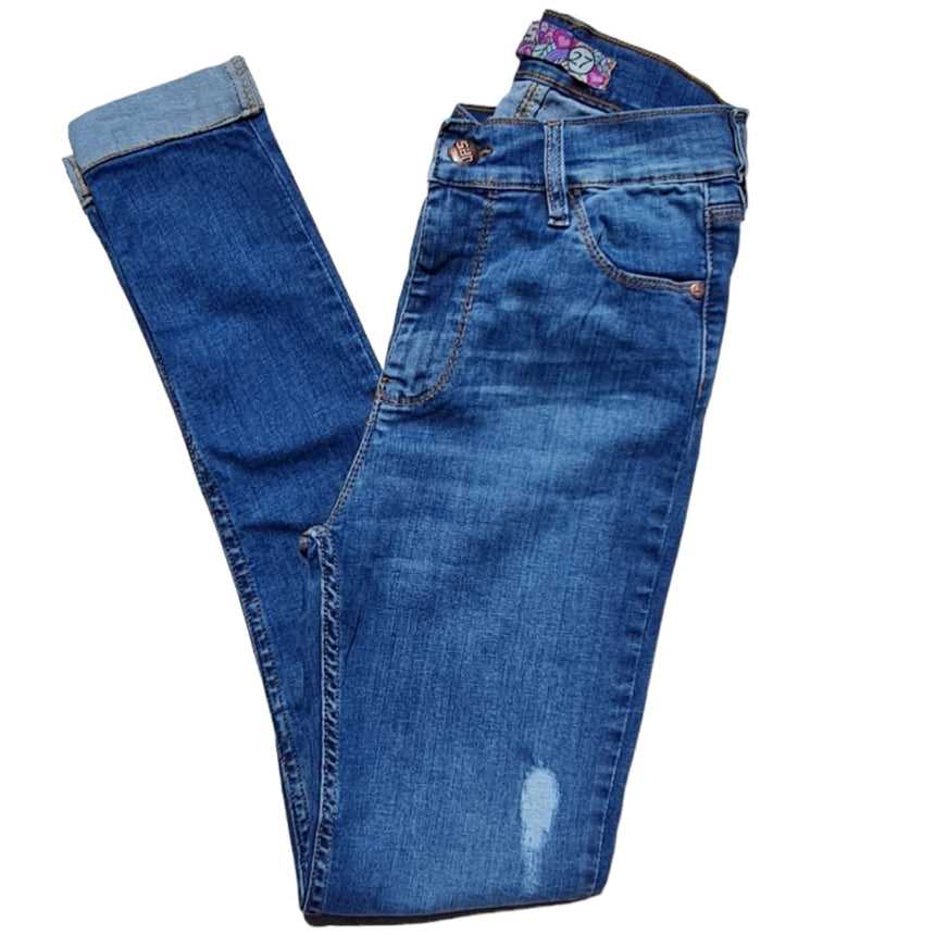 Skinny tiro alto con dobladillo y roturas