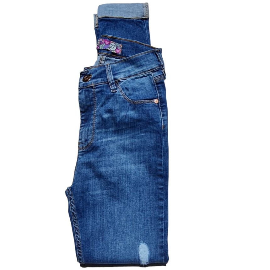 Skinny tiro alto con dobladillo y roturas